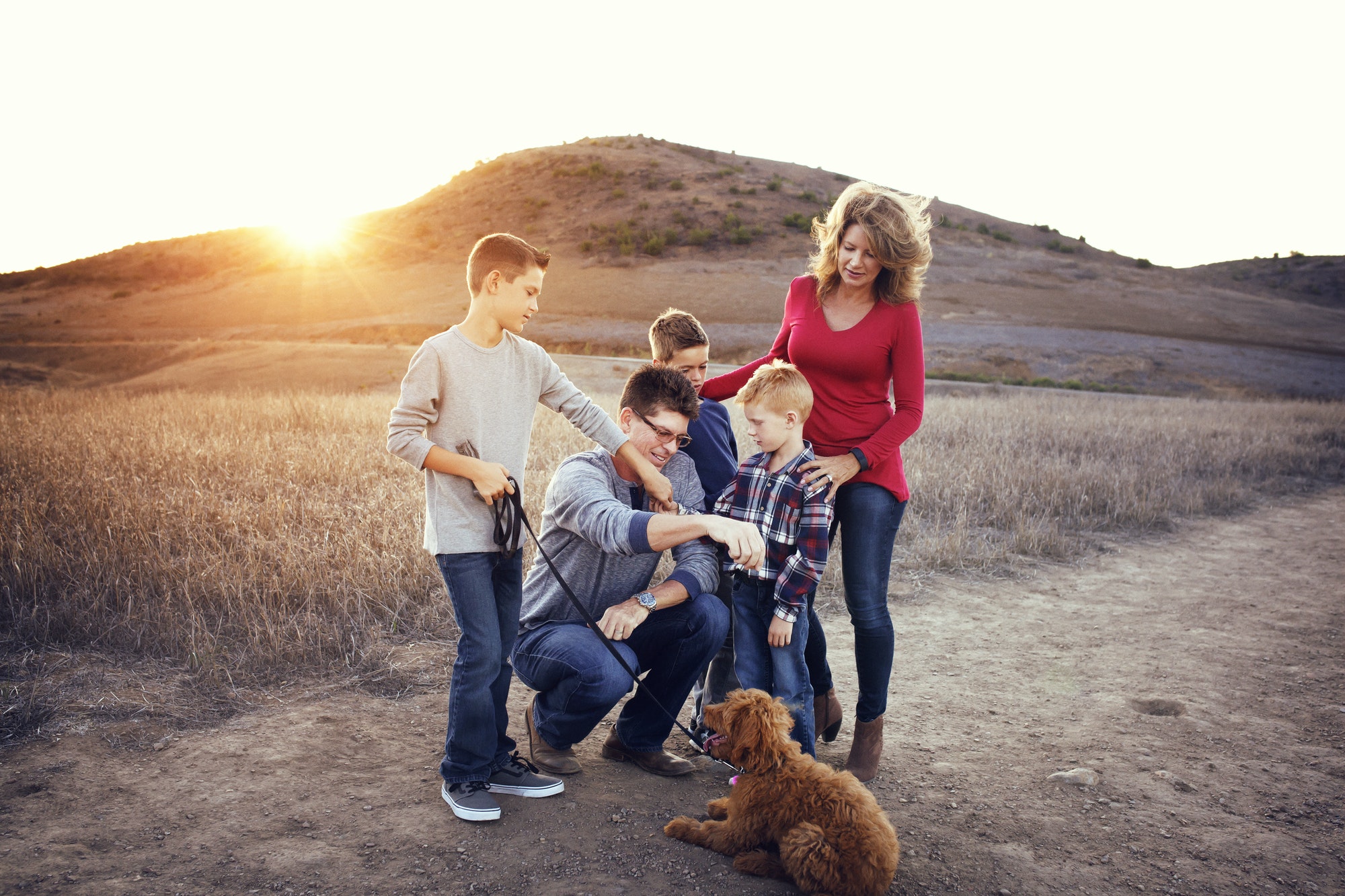 Family with dog enjoying outdoors