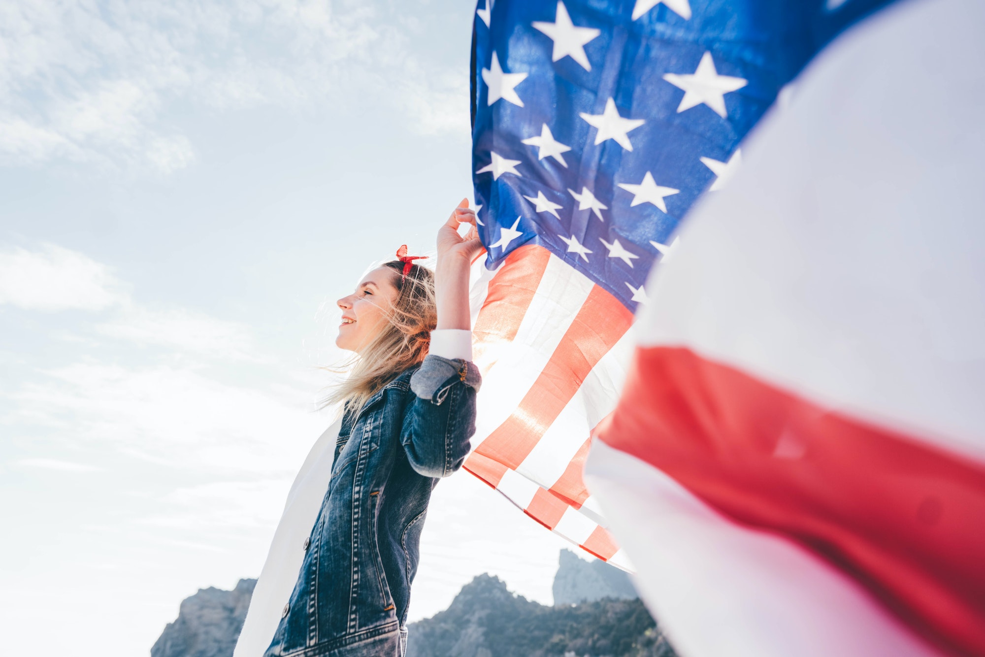 Woman holding United States flag