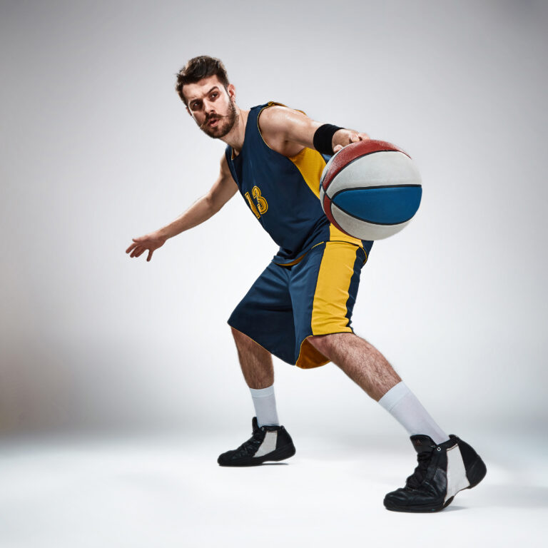 acfc Full length portrait of a basketball player with ball